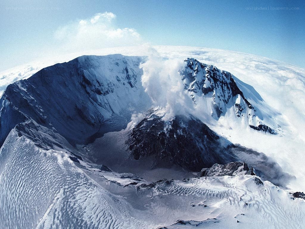 Snowy volcanic mountain peak
