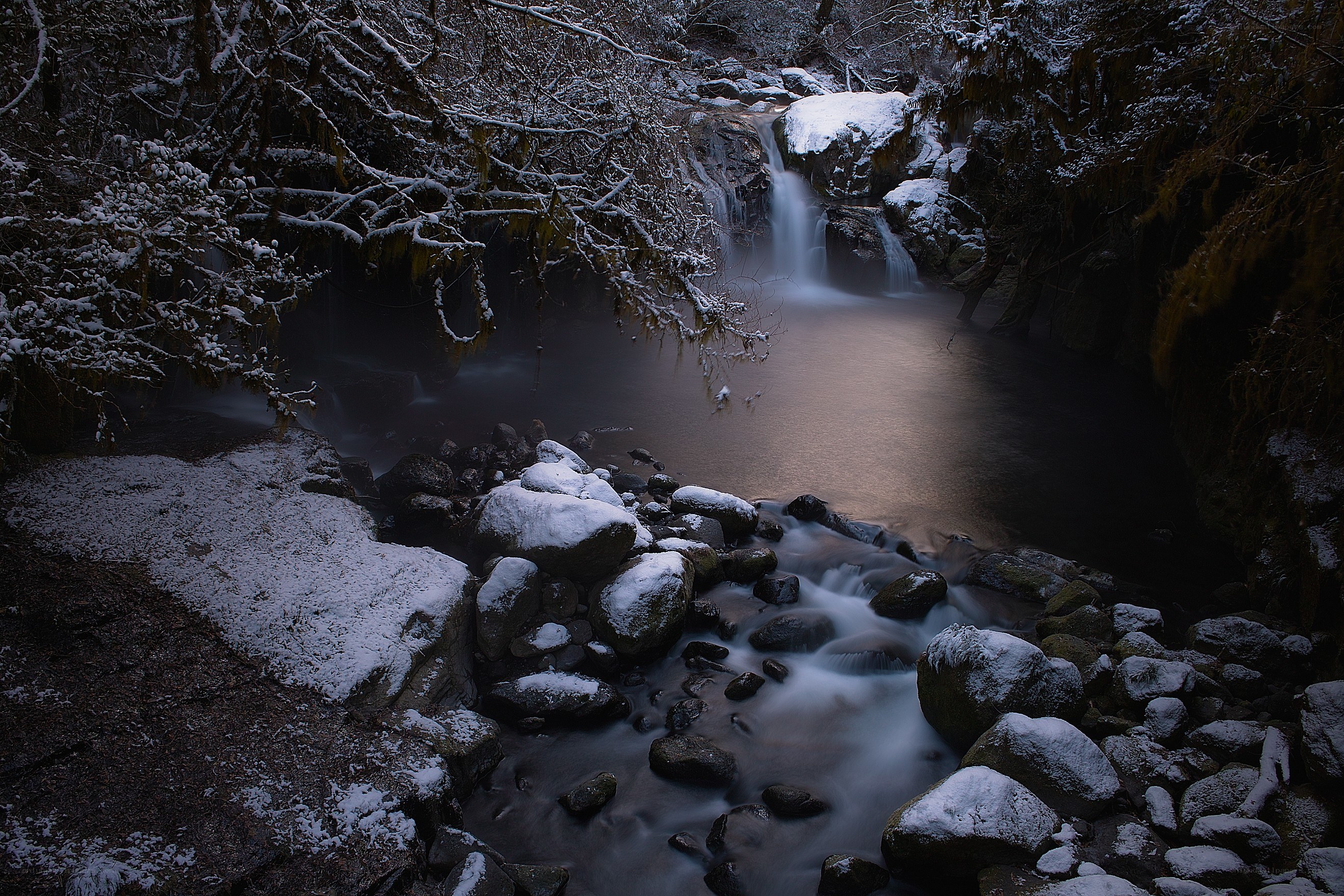Snowy waterfall at dusk