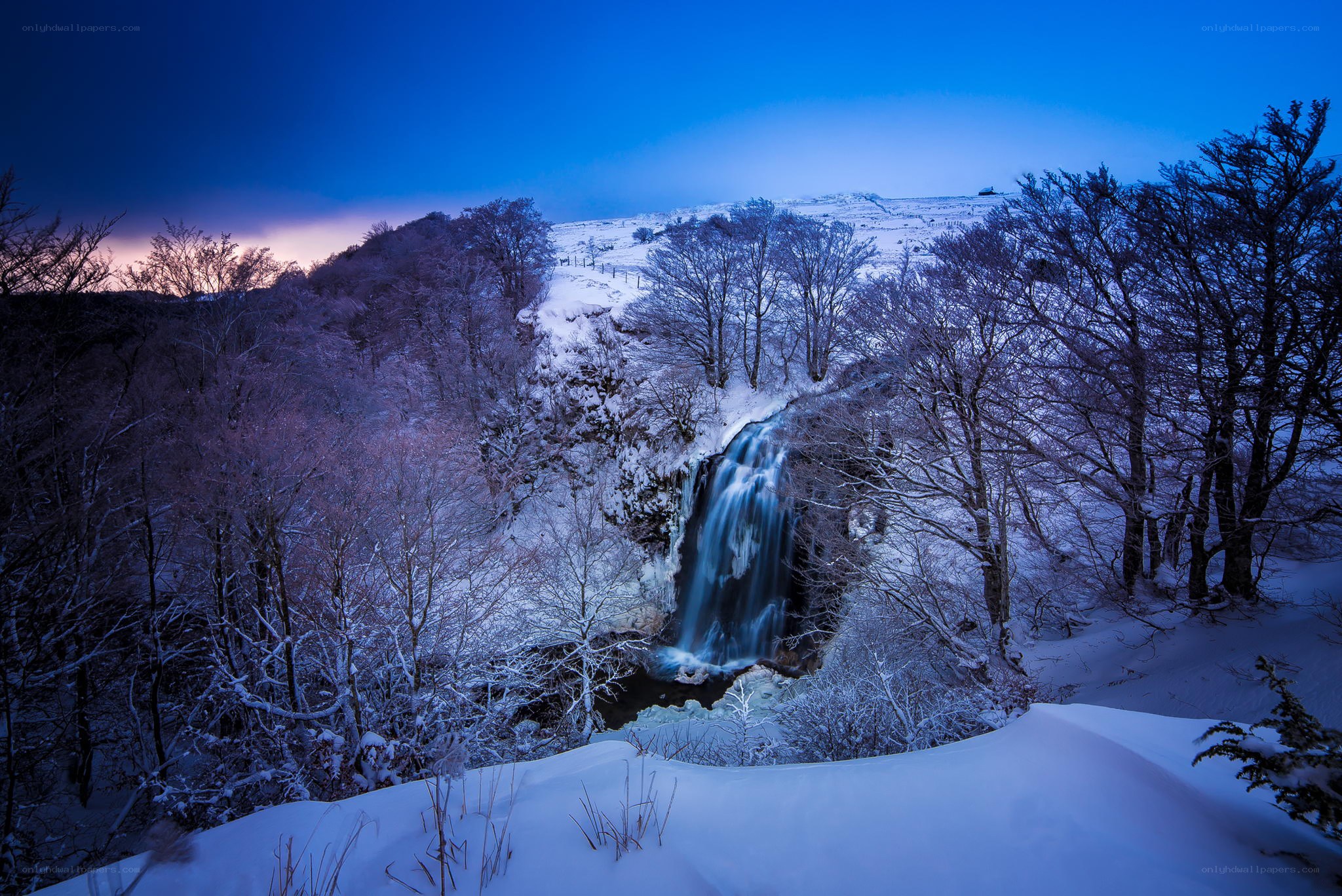 Snowy waterfall at dusk