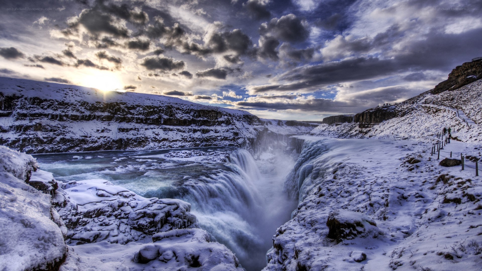 Snowy waterfall at sunset