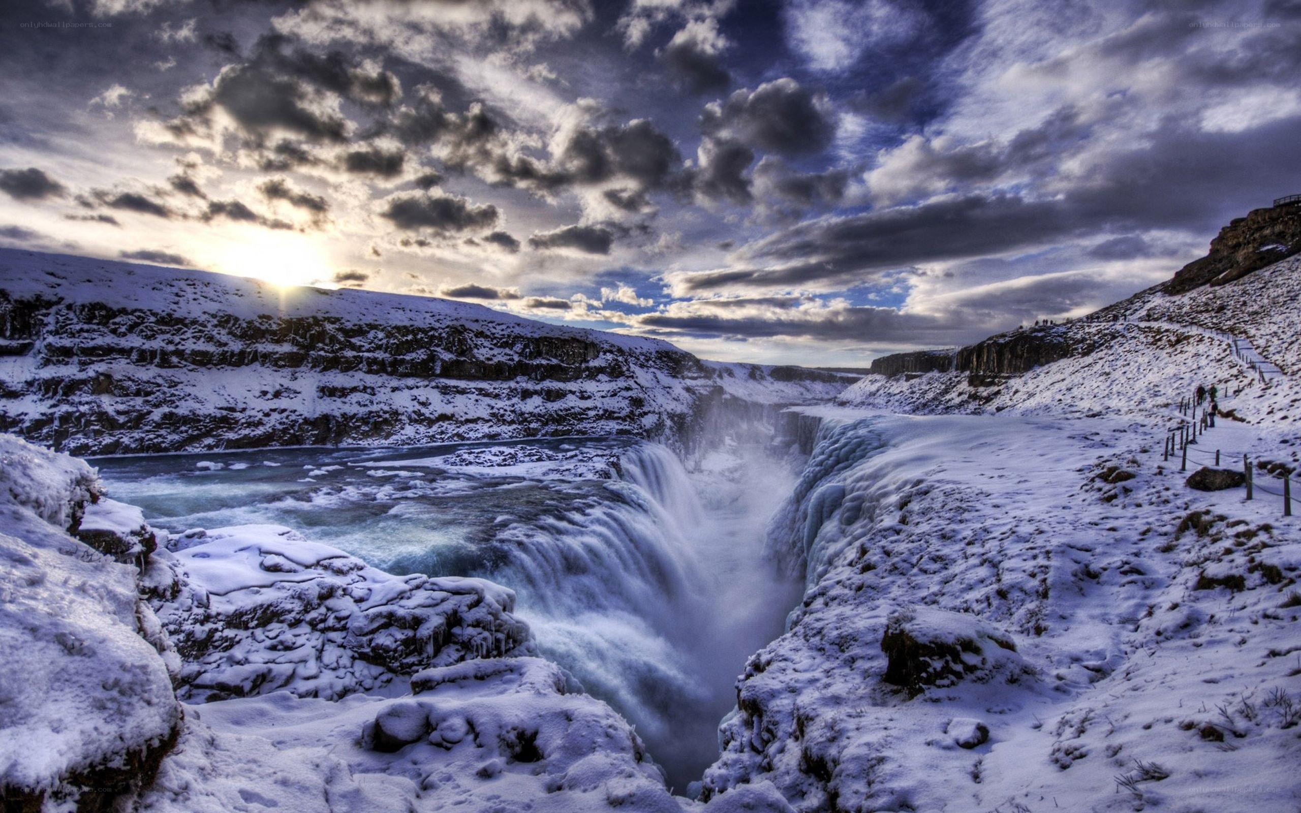 Snowy waterfall at sunset