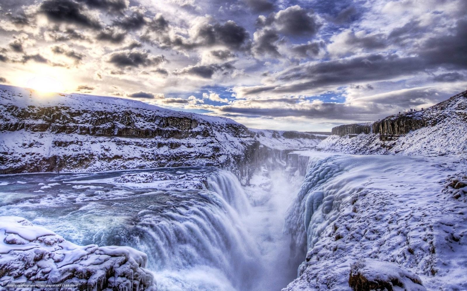 Snowy waterfall at sunset