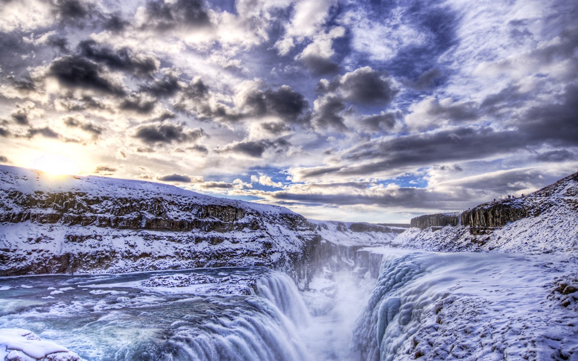 Snowy waterfall at sunset
