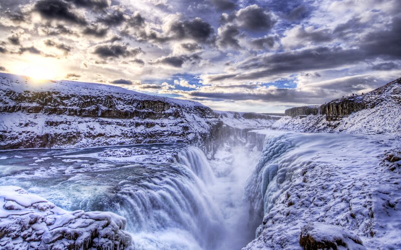 Snowy waterfall at sunset