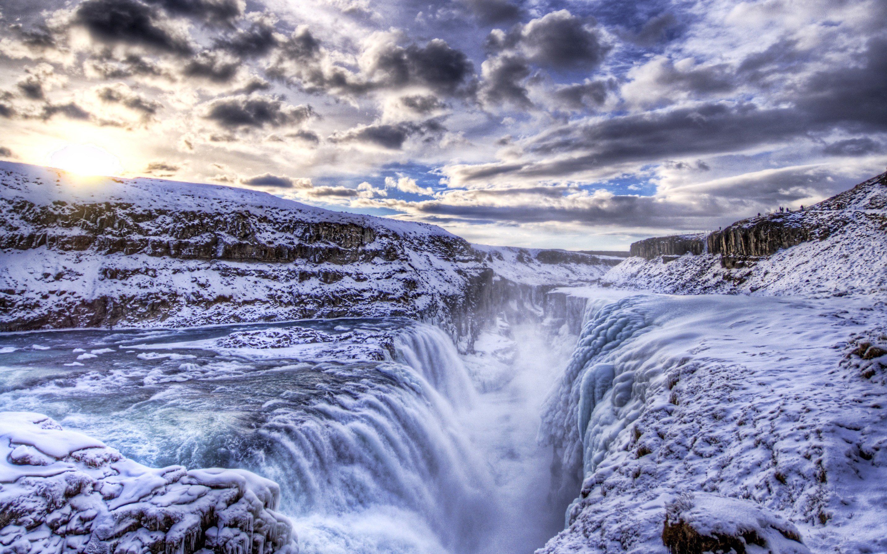 Snowy waterfall at sunset