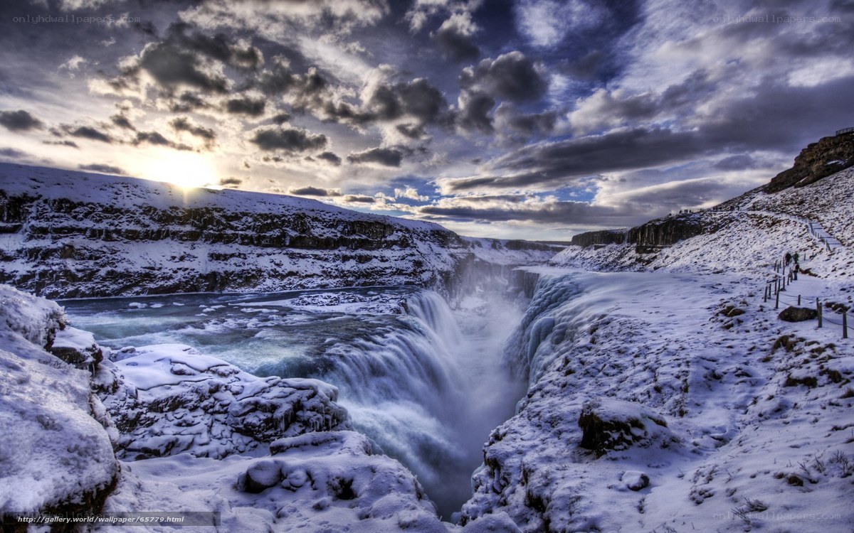 Snowy waterfall at sunset