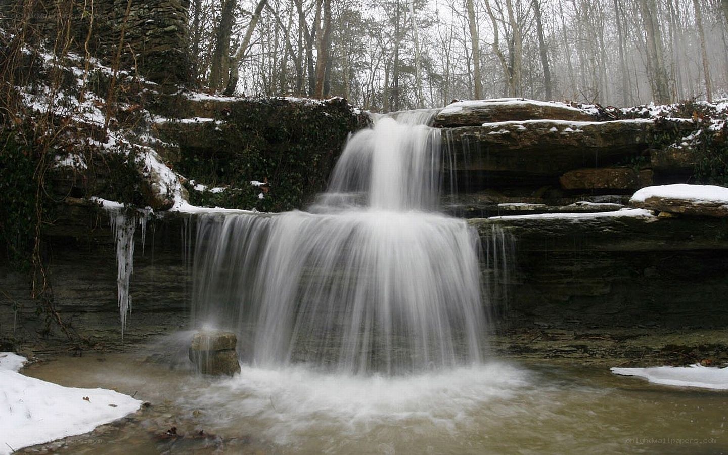 Snowy waterfall in forest
