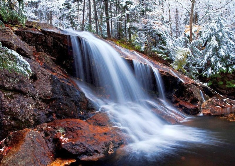 Snowy waterfall in forest