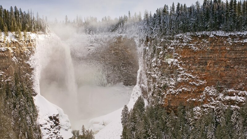 Snowy waterfall in forest