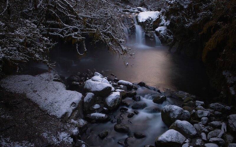 Snowy waterfall in forest