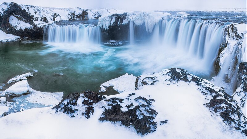 Snowy waterfall in winter