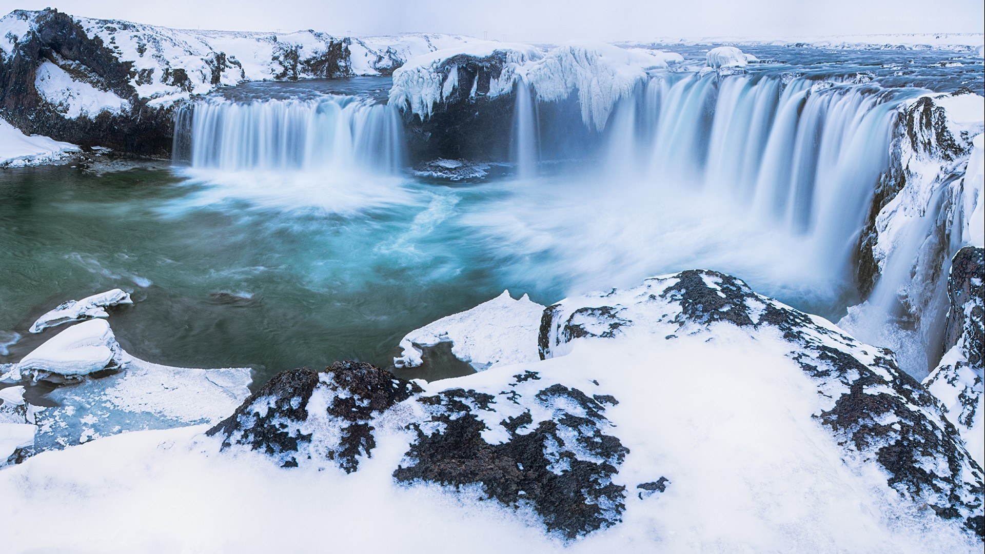 Snowy waterfall in winter