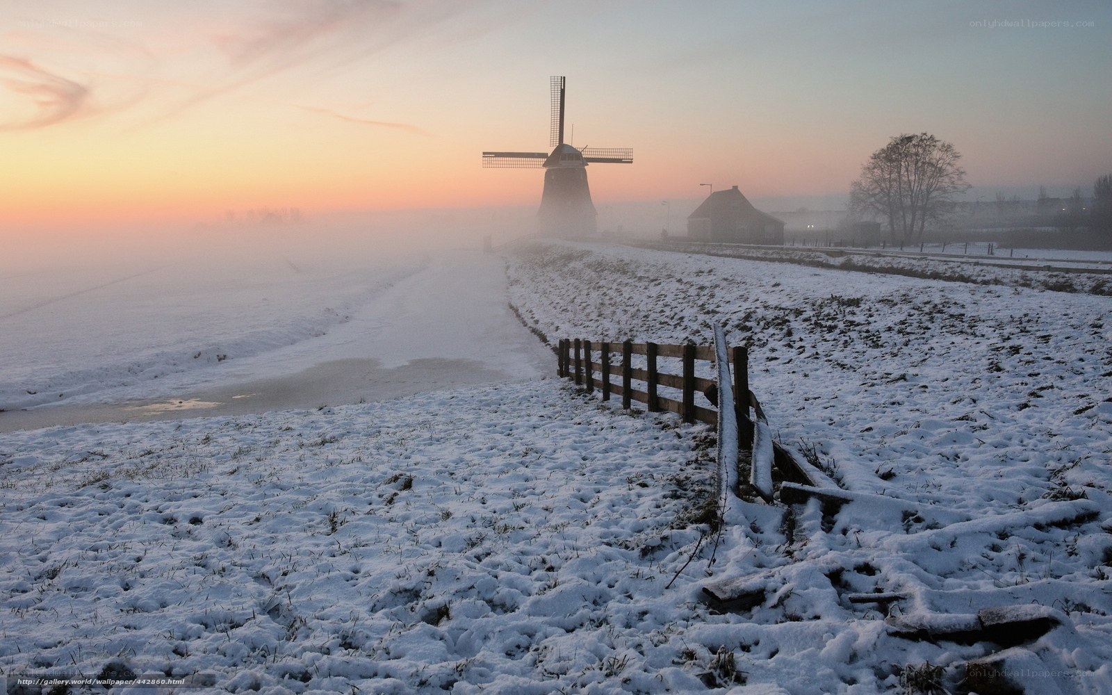 Snowy windmill at sunrise