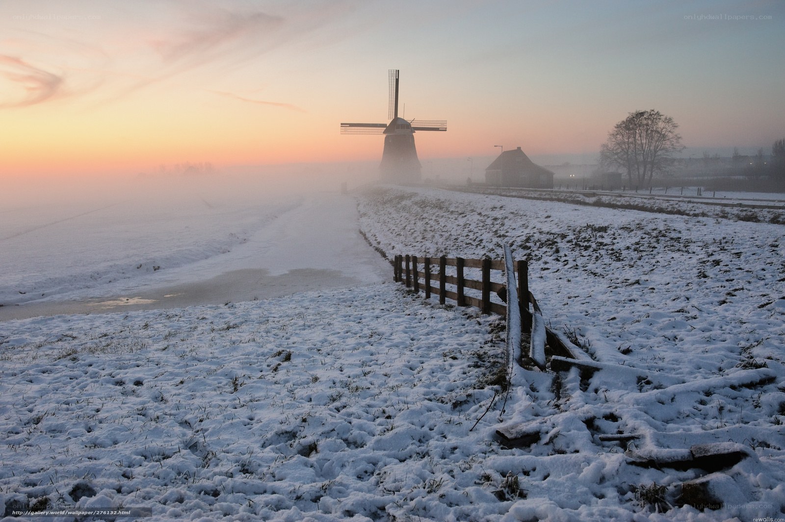 Snowy windmill at sunrise