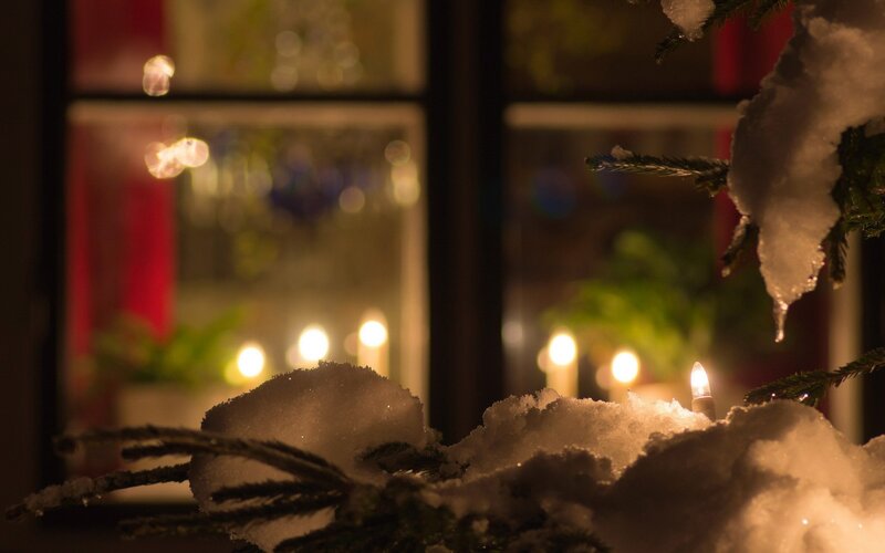 Snowy window with candles