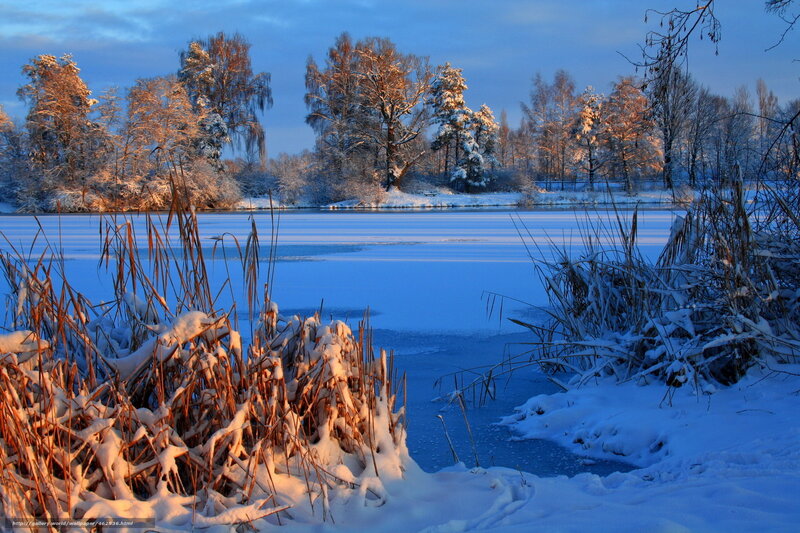 Snowy winter lake at sunset