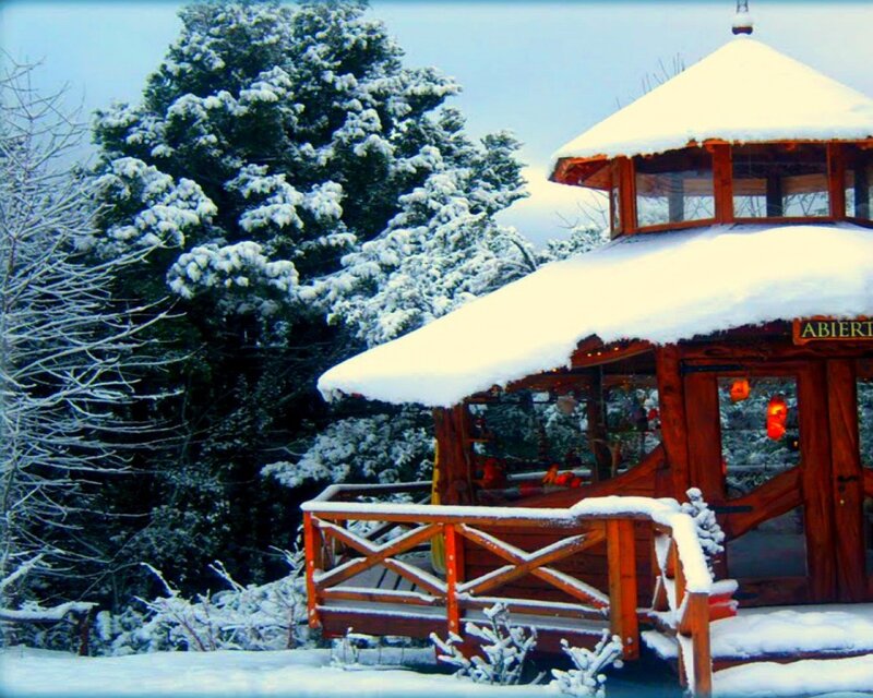 Snowy wooden gazebo in winter