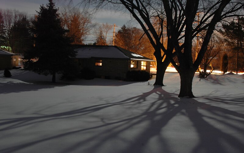 snowy yard at dusk