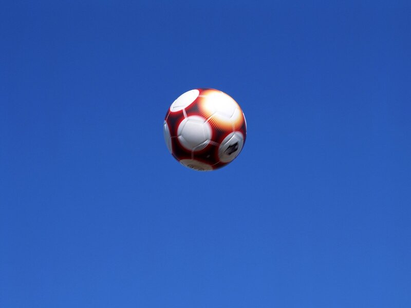 soccer ball in blue sky