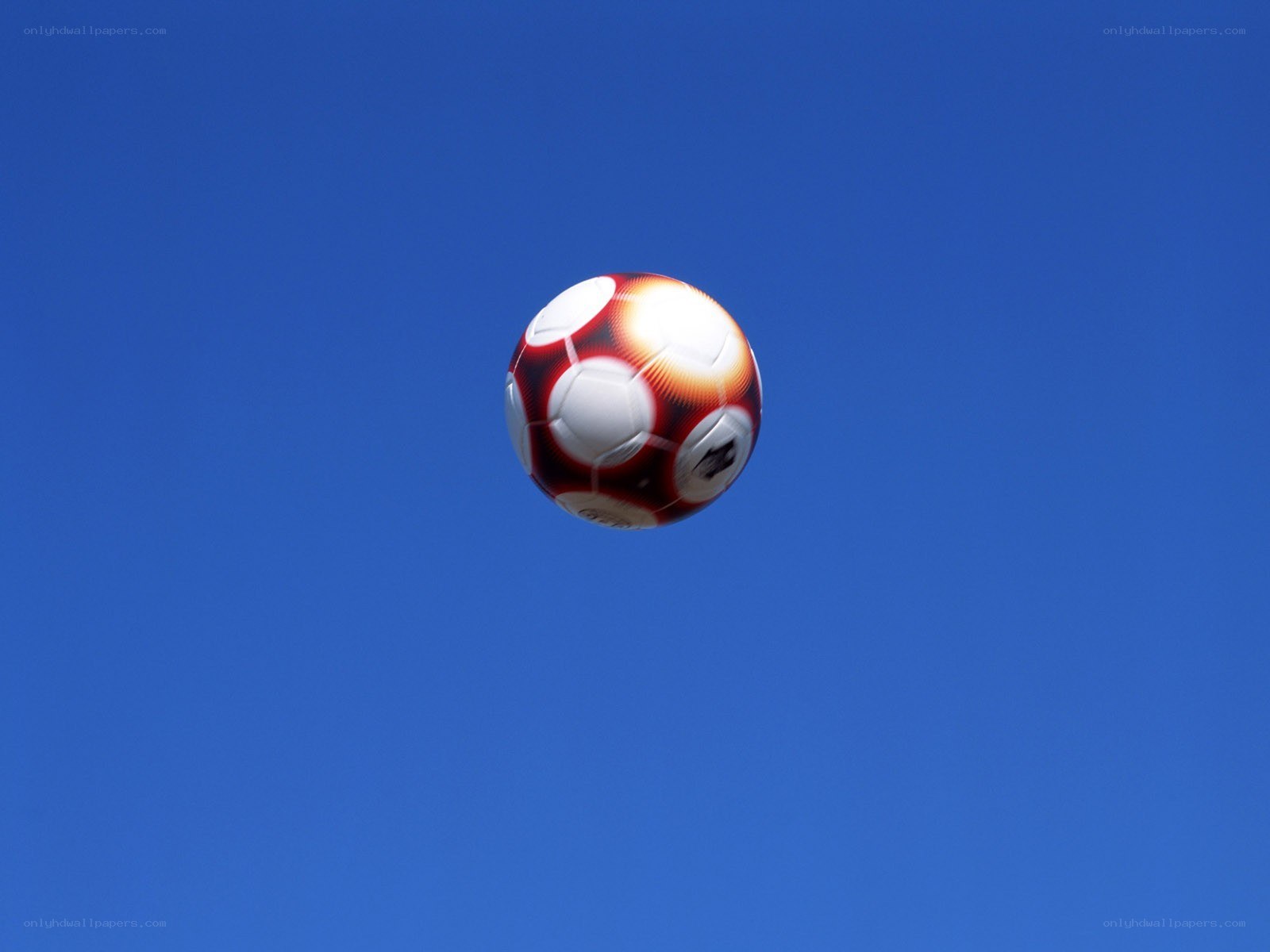 soccer ball in blue sky