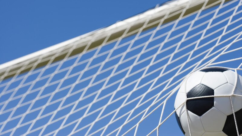 soccer ball in goal net