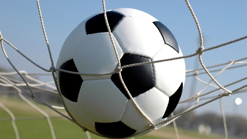 Soccer ball in goal net