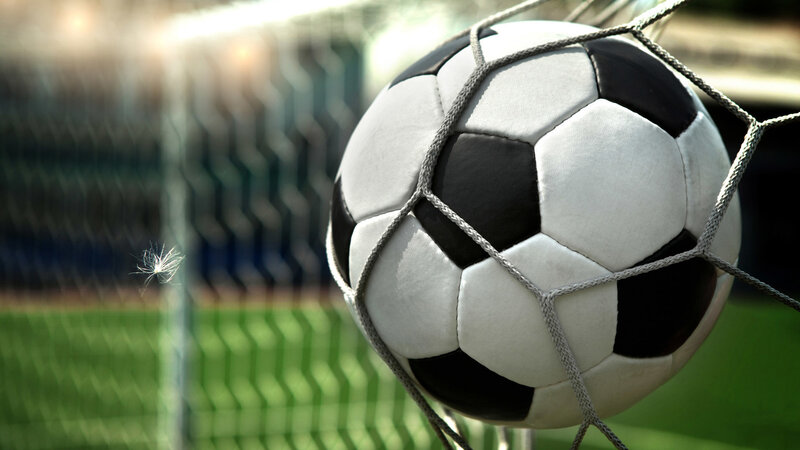 Soccer Ball in Goal Net — White, Dramatic, Afternoon