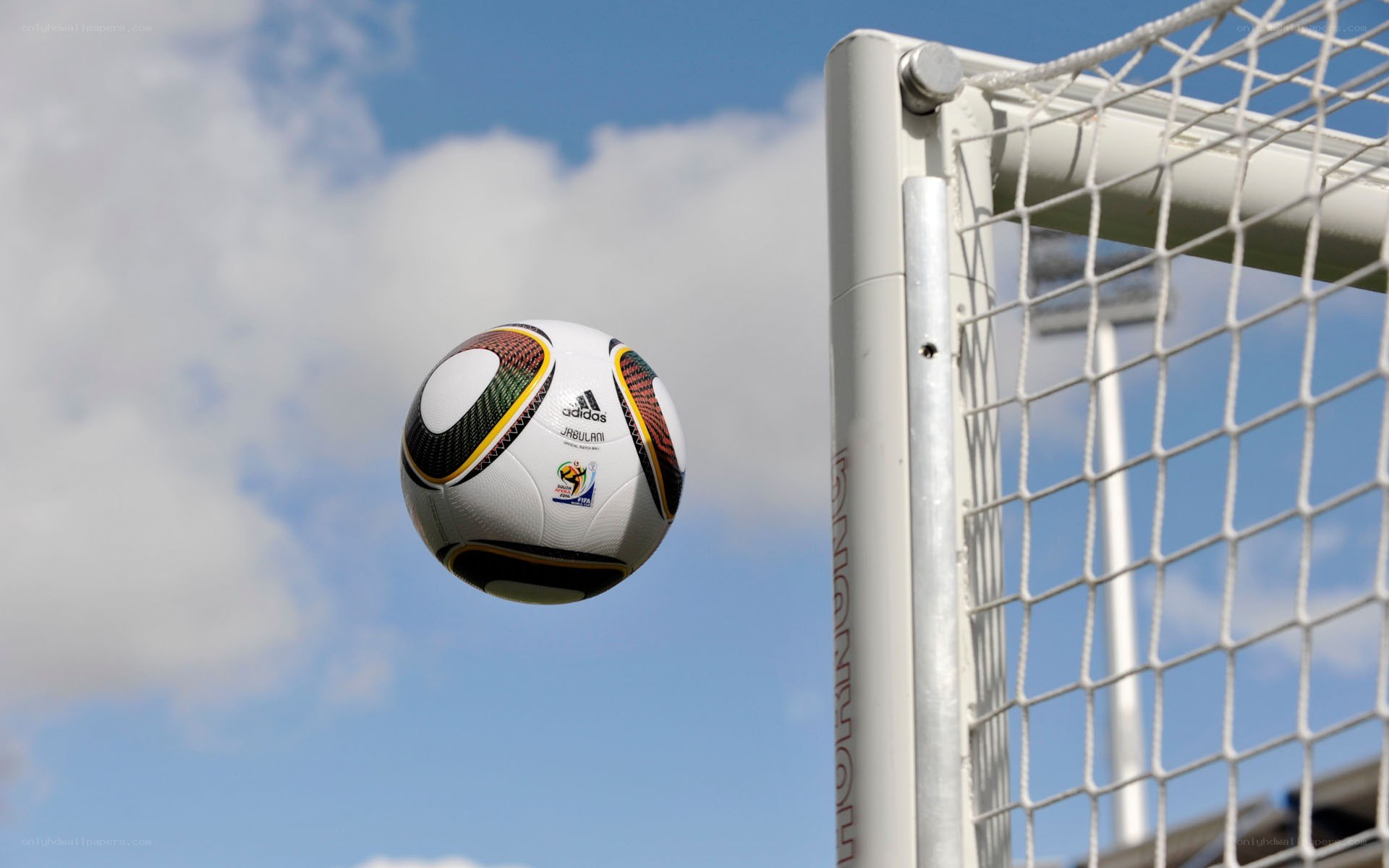 Soccer ball near goalpost
