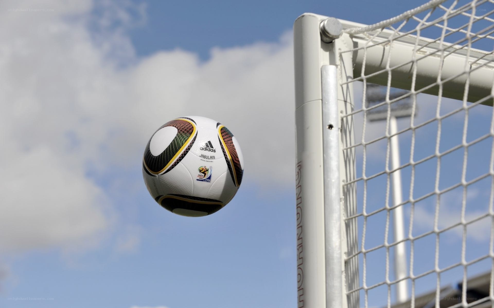 Soccer ball near goalpost
