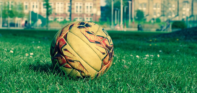 Soccer Ball on Grass — Green, Calm, Afternoon, Photograph, Building