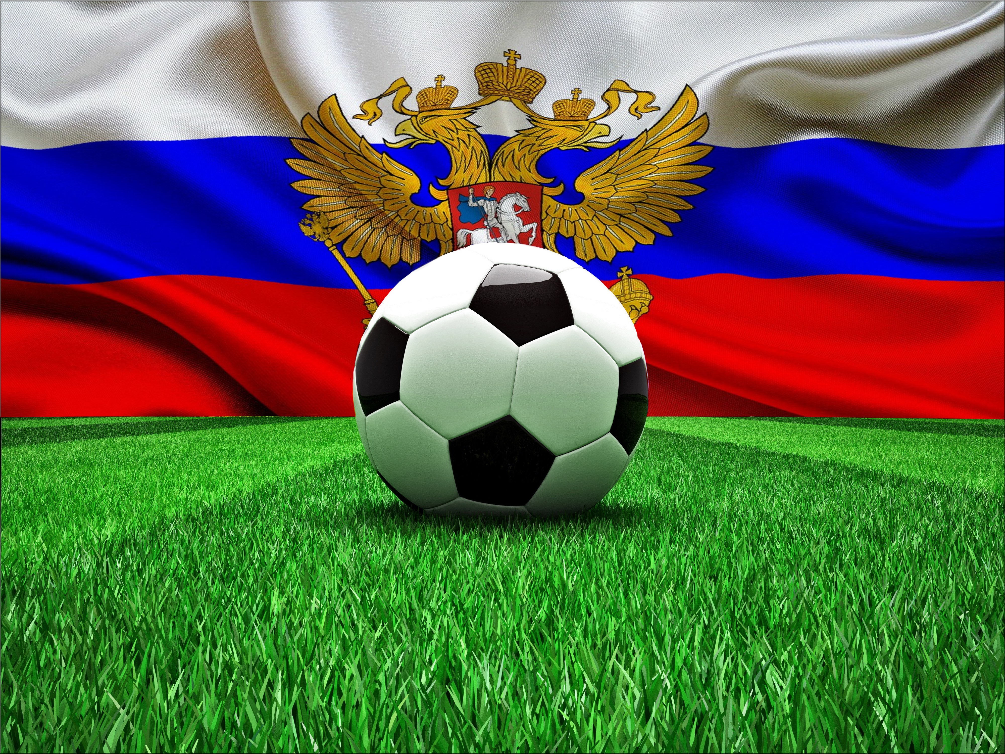 soccer ball on grass with russian flag