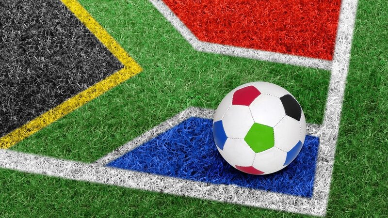 soccer ball on south african flag field