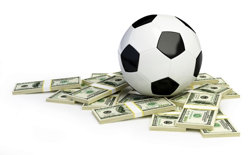 soccer ball with money stacks