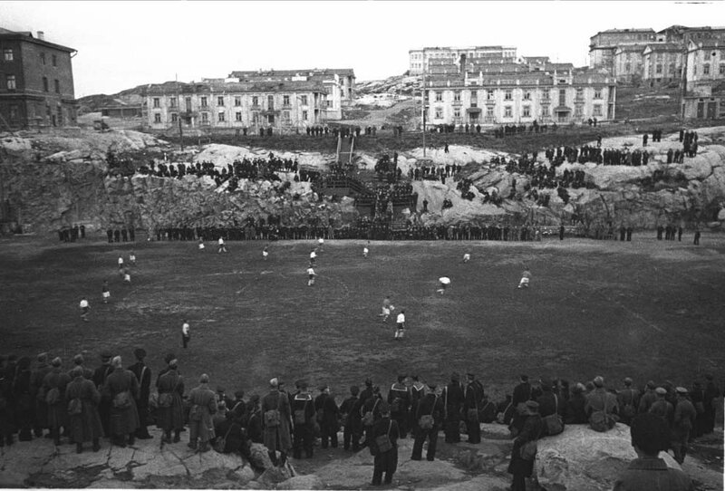 Soccer match at a coastal stadium