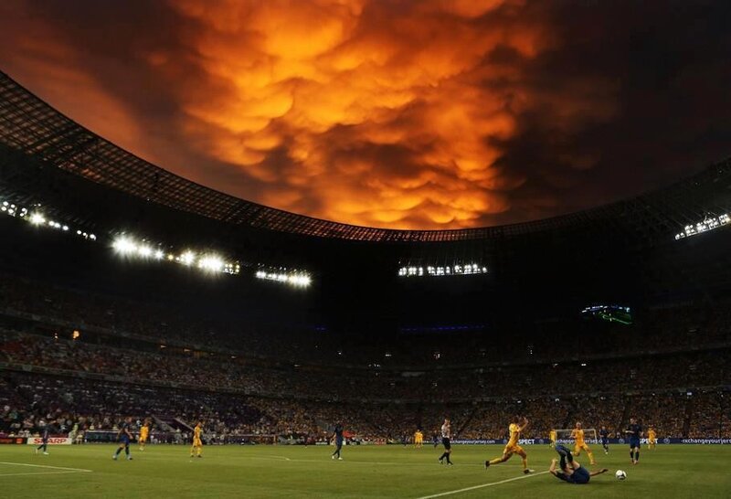 Soccer match under dramatic sky