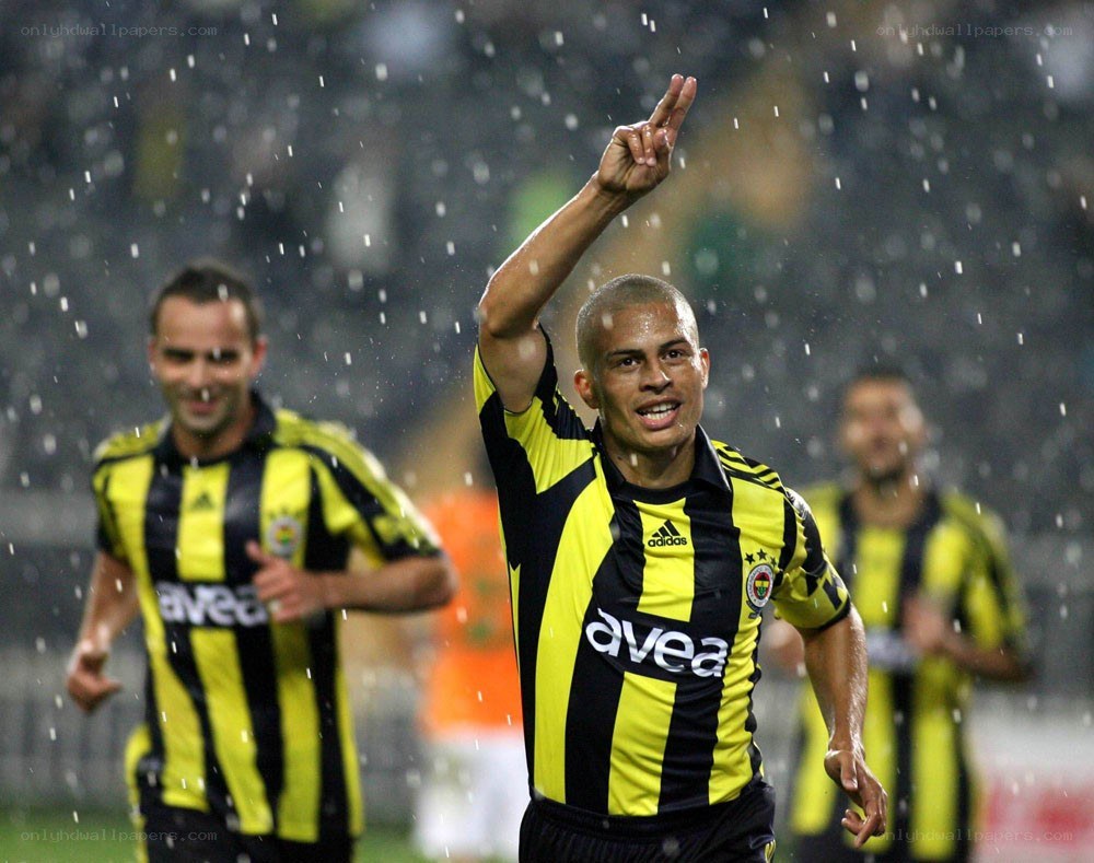 Soccer player celebrating in rain
