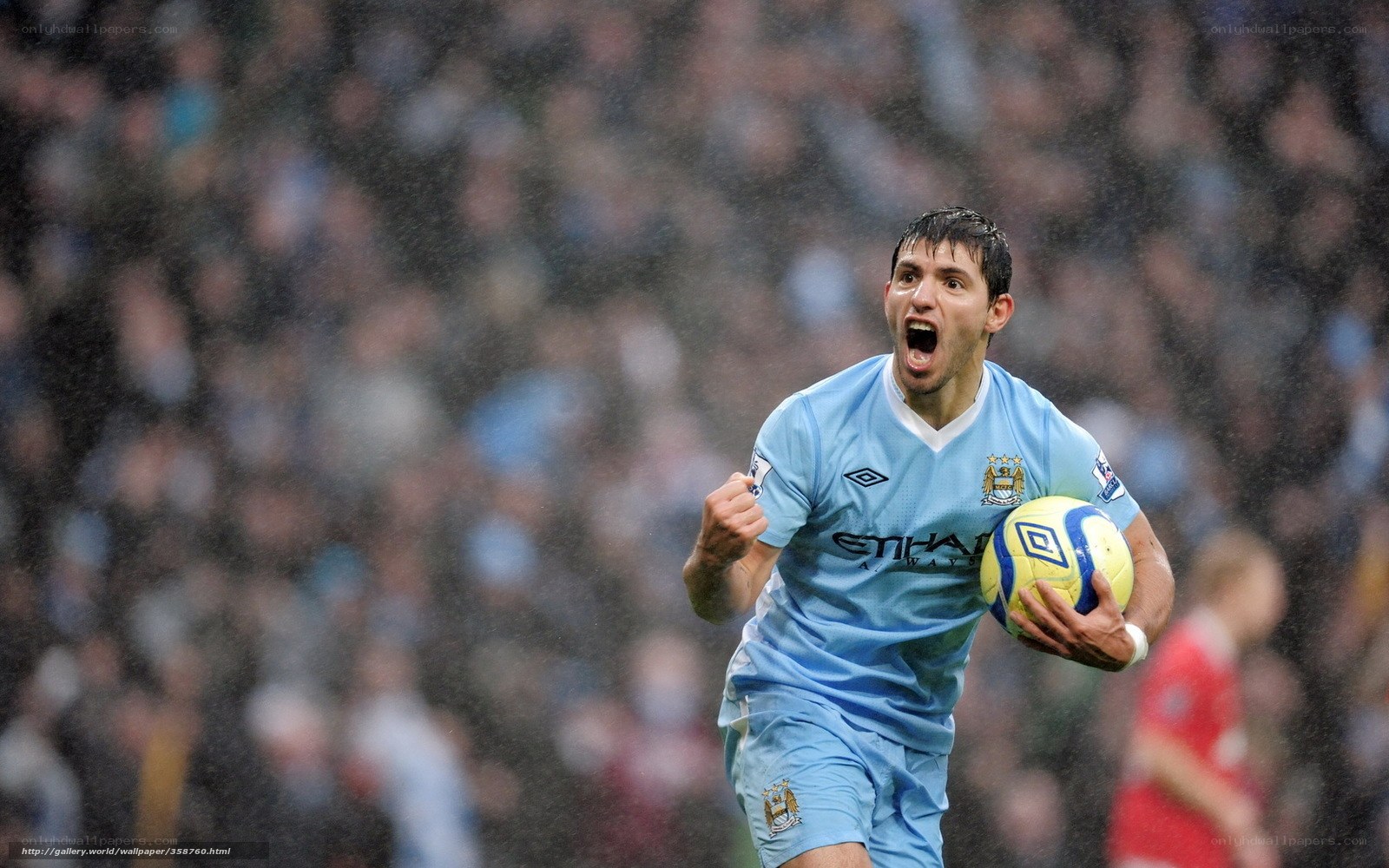 Soccer player celebrating with ball