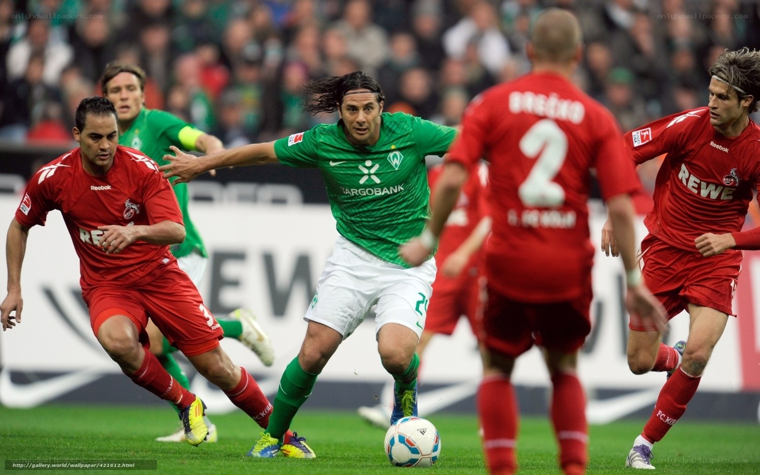 Soccer player dribbling past defenders