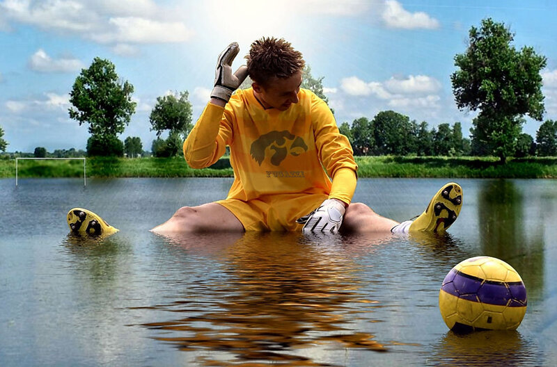 Soccer player in flooded field