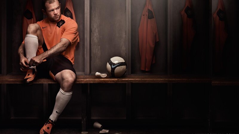 Soccer Player in Locker Room — Orange