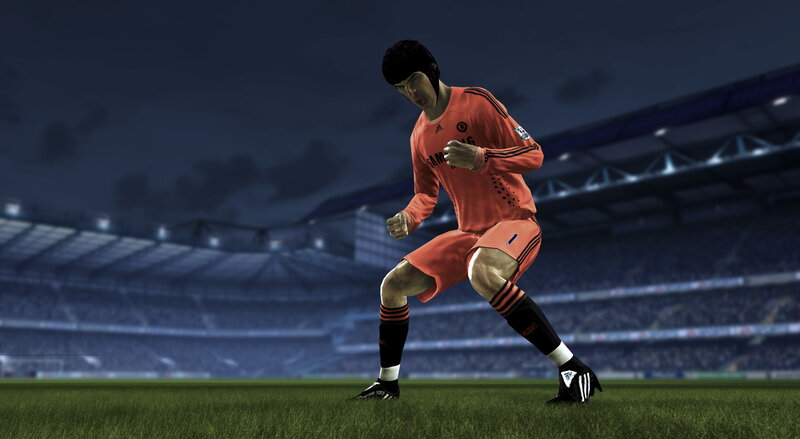 soccer player in orange kit