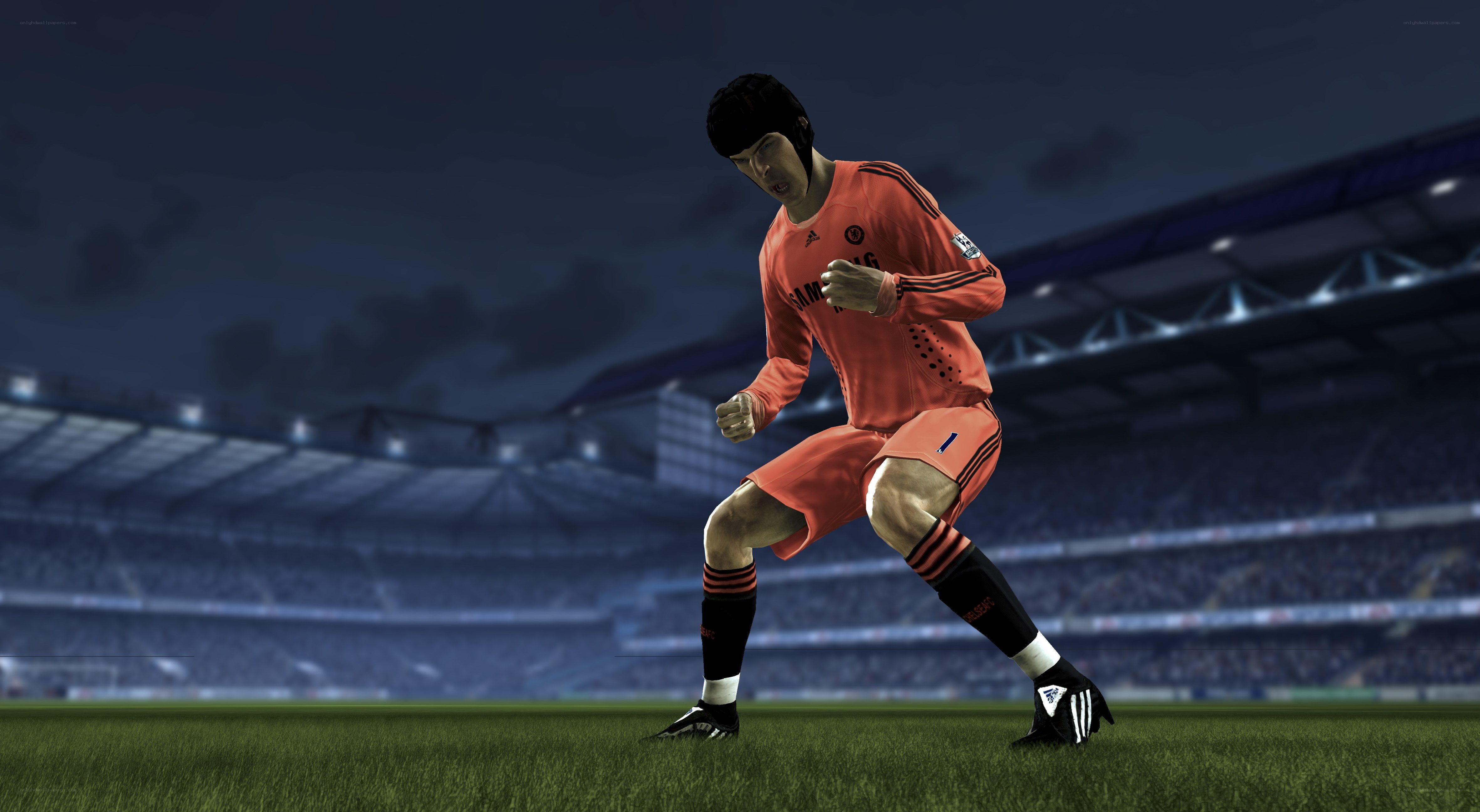 soccer player in orange kit