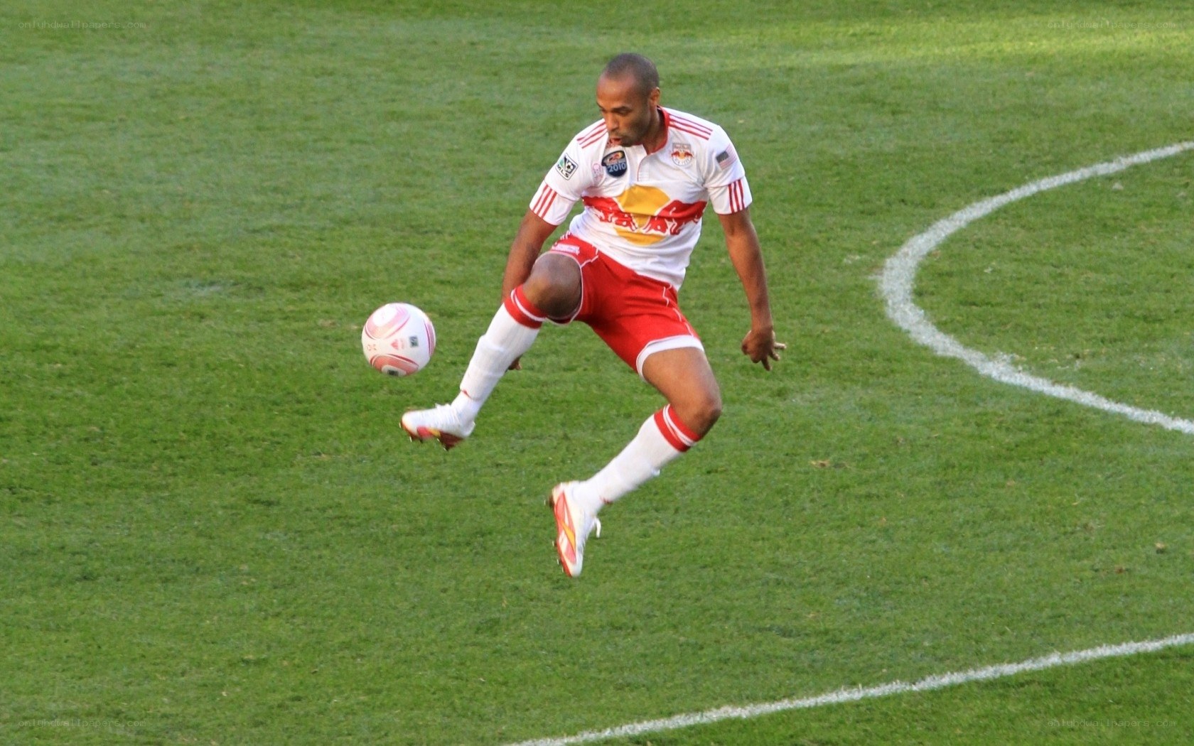 soccer player kicking ball