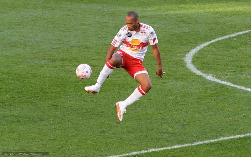 soccer player kicking ball
