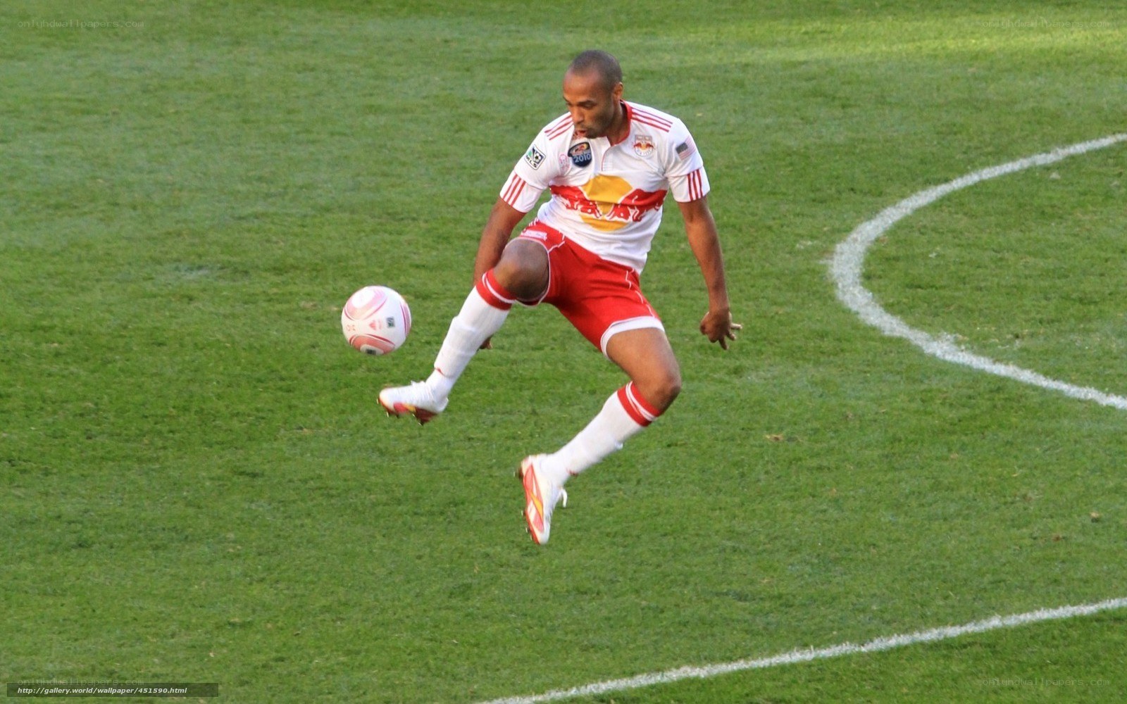 soccer player kicking ball