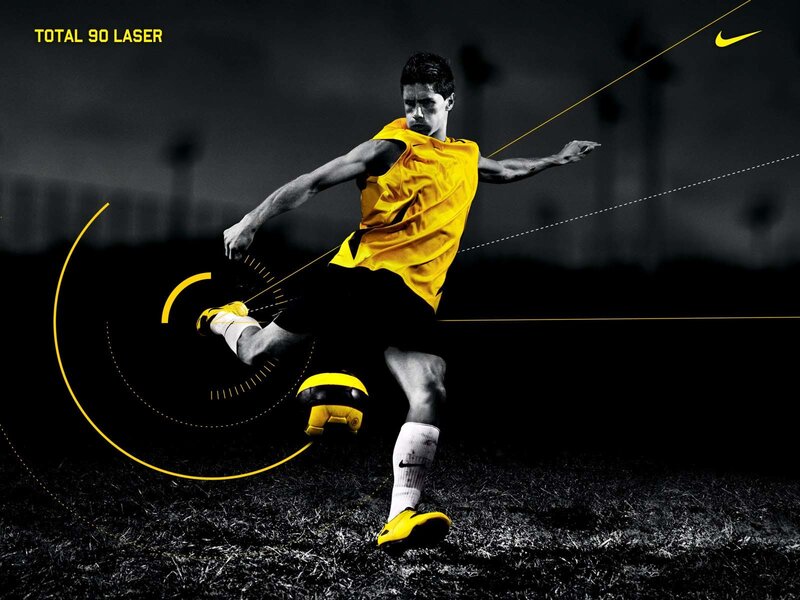 soccer player kicking ball