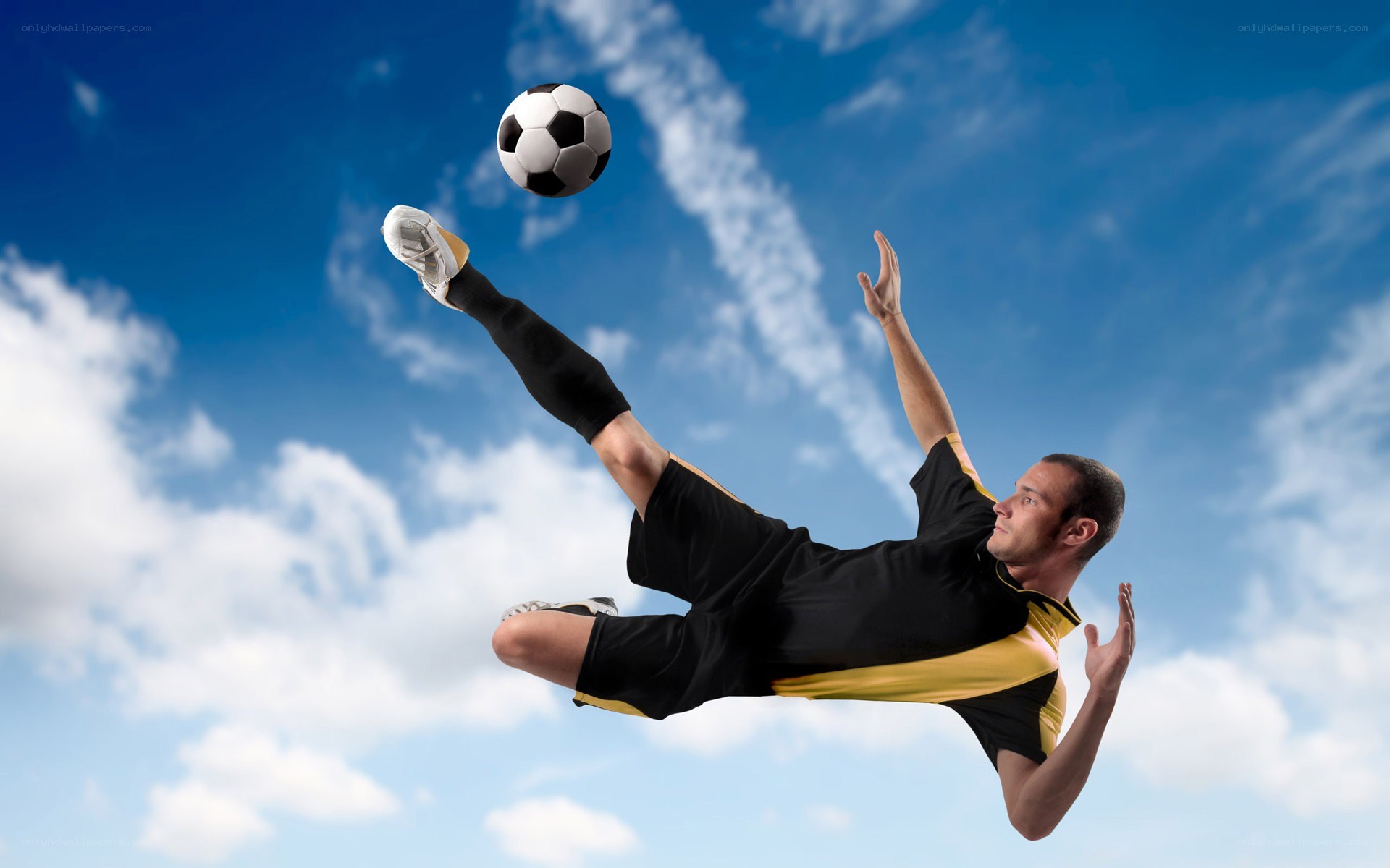soccer player kicking ball