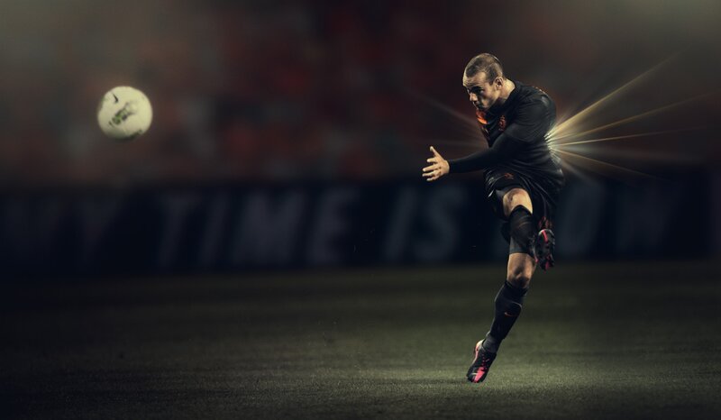 soccer player kicking ball