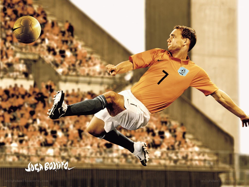 soccer player kicking ball