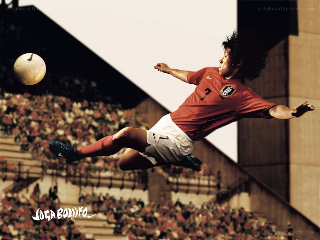 soccer player kicking ball